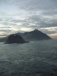 Sun setting on isles off San Sebastian/Donostia